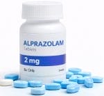 Bottle of alprazolam tablets with pills