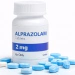 Bottle of alprazolam tablets with pills