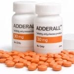 Prescription bottles with orange tablets