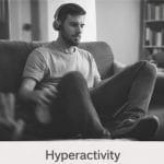 Person sitting on couch with headphones adhd.