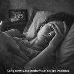 Woman struggling with insomnia at night