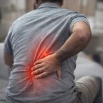 Person experiencing back pain